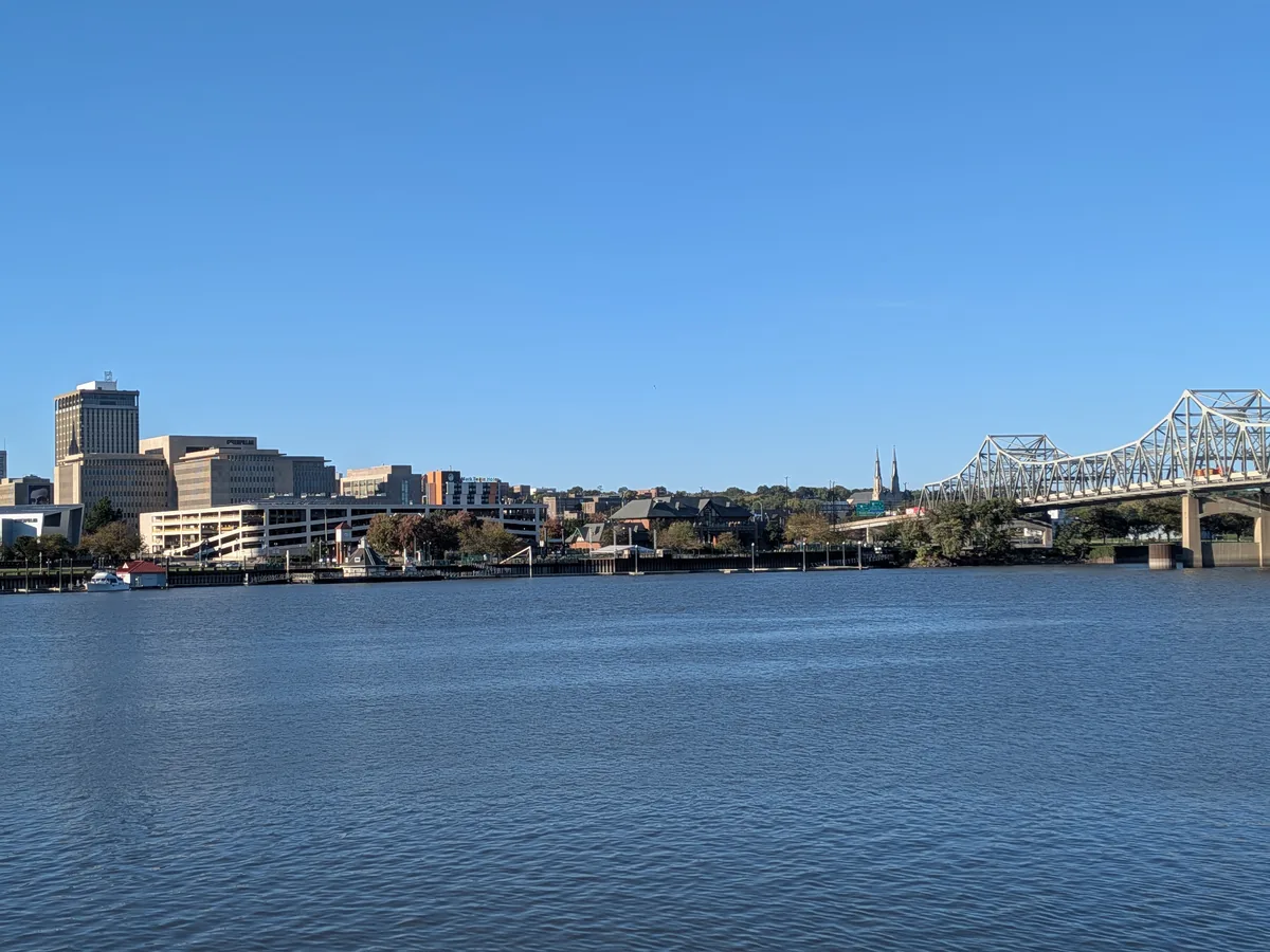 Downtown Peoria's riverfront with church spires and the bridge on the right